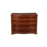 A mahogany and marquetry inlaid serpentine fronted chest of drawers