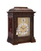 A Renaissance Revival carved walnut mantel clock