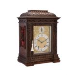 A Renaissance Revival carved walnut mantel clock