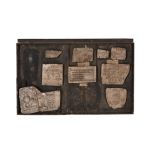 A framed collection of plaster casts of Early Modern printing blocks