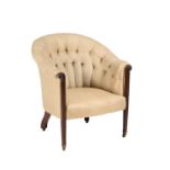 A mahogany button back tub chair in Regency style