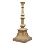 A CONTINENTAL GOLD AND GREY PAINTED PLASTER CANDLE STAND OR ALTARSTICK