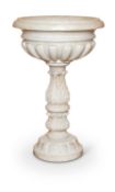 AN ITALIAN SCULPTED WHITE MARBLE CISTERN OR FONT