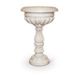 AN ITALIAN SCULPTED WHITE MARBLE CISTERN OR FONT