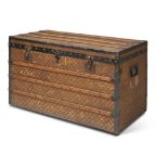 A FRENCH CANVAS AND WOODEN BOUND TRUNK, BY BIGOT