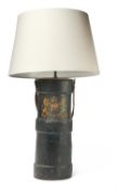 A BRITISH MILITARY ARTILLERY SHELL CARRYING CASE CONVERTED TO A TABLE LAMP
