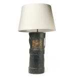 A BRITISH MILITARY ARTILLERY SHELL CARRYING CASE CONVERTED TO A TABLE LAMP