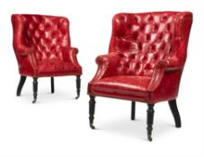 A PAIR OF LEATHER BUTTON UPHOLSTERED WING ARMCHAIRS