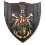 A STAINED PINE PAINTED ARMORIAL PANEL, MODERN