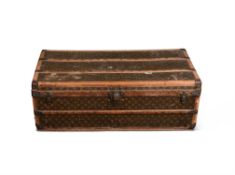 A LOUIS VUITTON CANVAS, WOOD AND LEATHER BOUND TRUNK