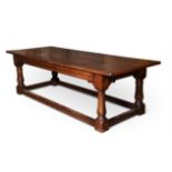 A STAINED OAK REFECTORY TABLE IN EARLY 18TH CENTURY STYLE