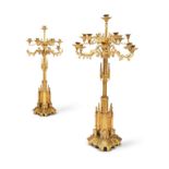 A PAIR OF IMPRESSIVE GILT BRASS GOTHIC REVIVAL CANDELABRA