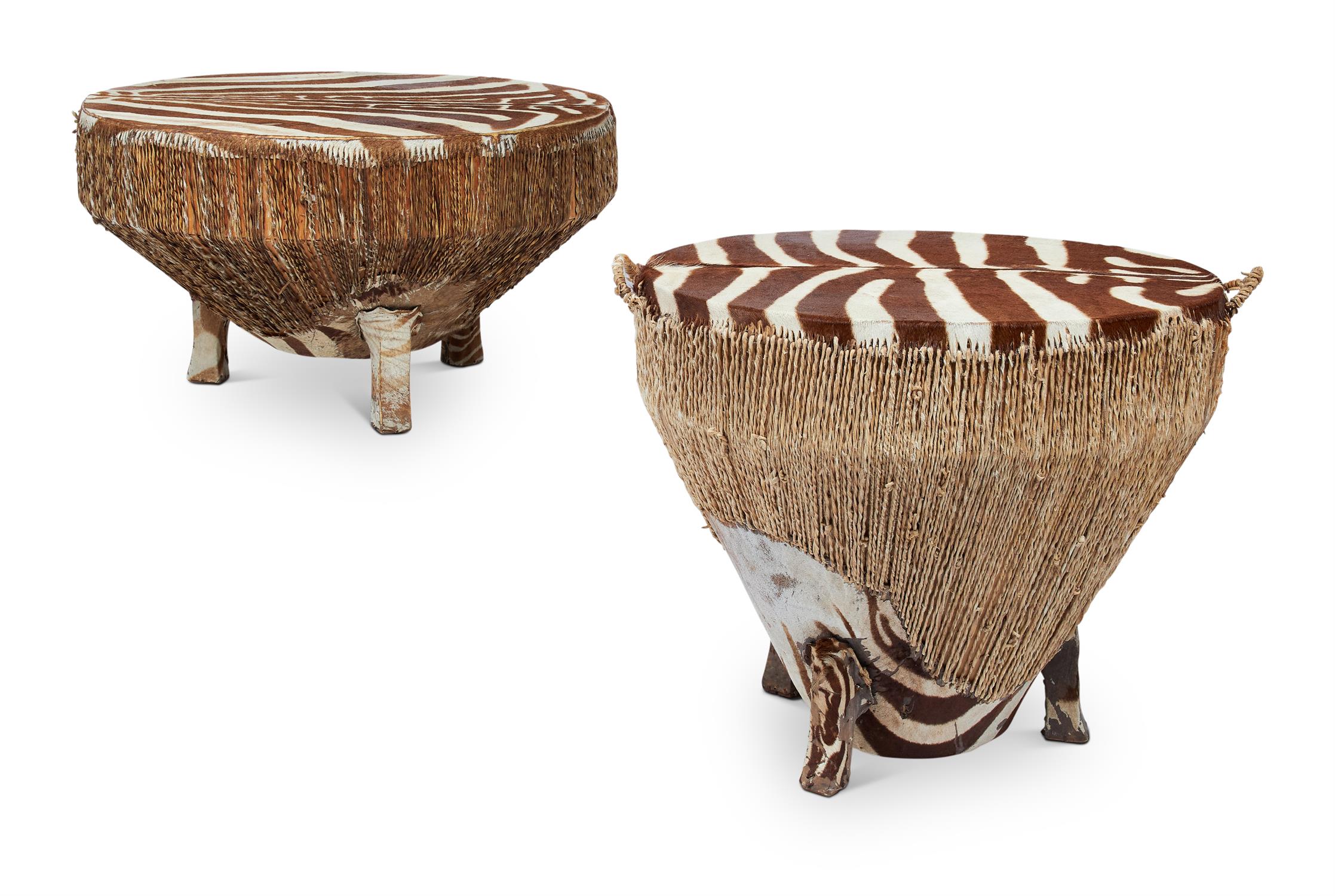 A NEAR PAIR OF AFRICAN ZEBRA SKIN DRUM TABLES