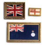 A GROUP OF THREE ASSORTED GILT FRAMED FLAGS