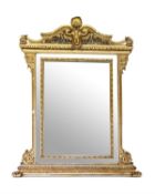AN ITALIAN CARVED GILTWOOD AND COMPOSITION OVERMANTEL WALL MIRROR