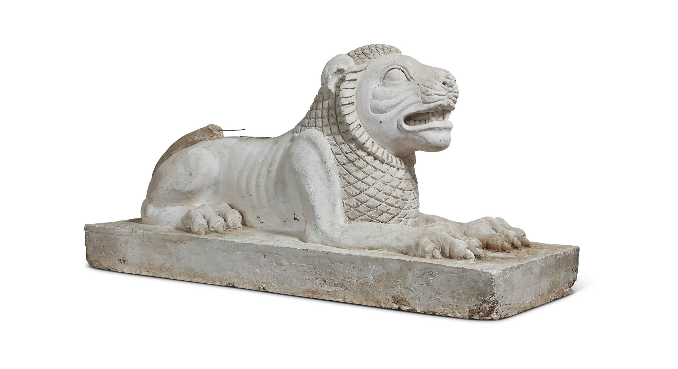 A PLASTER MODEL OF A RECUMBENT LION 20TH CENTURY