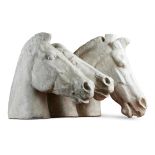A LARGE PLASTER CAST OF THREE HORSES' HEADS