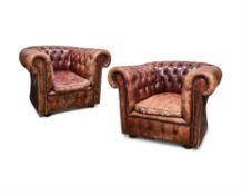 A PAIR OF BROWN LEATHER BUTTON UPHOLSTERED ARMCHAIRS