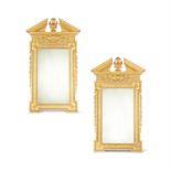 A PAIR OF GILTWOOD AND COMPOSITION WALL MIRRORS