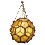 A LARGE GILT METAL AND YELLOW TINTED GLASS HALL LANTERN