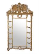 A MONUMENTAL GILTWOOD AND COMPOSITION WALL MIRROR, LATE 19TH CENTURY