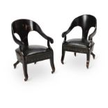 A PAIR OF REGENCY STYLE EBONISED 'ROMAN' ARMCHAIRS