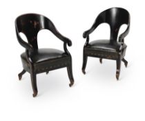 A PAIR OF REGENCY STYLE EBONISED 'ROMAN' ARMCHAIRS