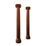 A PAIR OF LARGE CARVED STRIPPED CEDAR COLUMNS