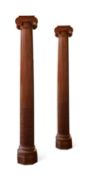 A PAIR OF LARGE CARVED STRIPPED CEDAR COLUMNS