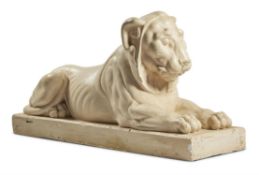 A PAINTED PLASTER MODEL OF A LION