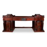 AN IRISH WILLIAM IV MAHOGANY, EBONISED AND EBONY INLAID PEDESTAL SIDEBOARD