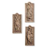 A SET OF THREE TINTED PLASTER TROPHY PANELS