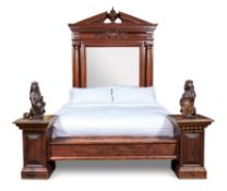 A LARGE CARVED MAHOGANY BED