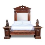 A LARGE CARVED MAHOGANY BED