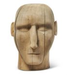 AN OVER LIFE-SIZED CARVED WOODEN HEAD, 20TH CENTURY