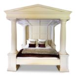 A LARGE WHITE PAINTED FOUR POSTER BED