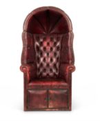 A RED LEATHER BUTTON UPHOLSTERED PORTER'S CHAIR