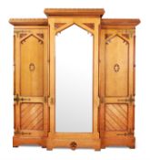 A VICTORIAN GOTHIC REVIVAL TRIPLE WARDROBE, CIRCA 1870