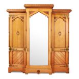 A VICTORIAN GOTHIC REVIVAL TRIPLE WARDROBE, CIRCA 1870