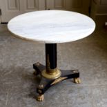 AN EBONISED GILT METAL MOUNTED AND MARBLE TOPPED CENTRE TABLE IN REGENCY STYLE