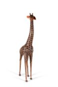 A painted papier Mache model of a giraffe