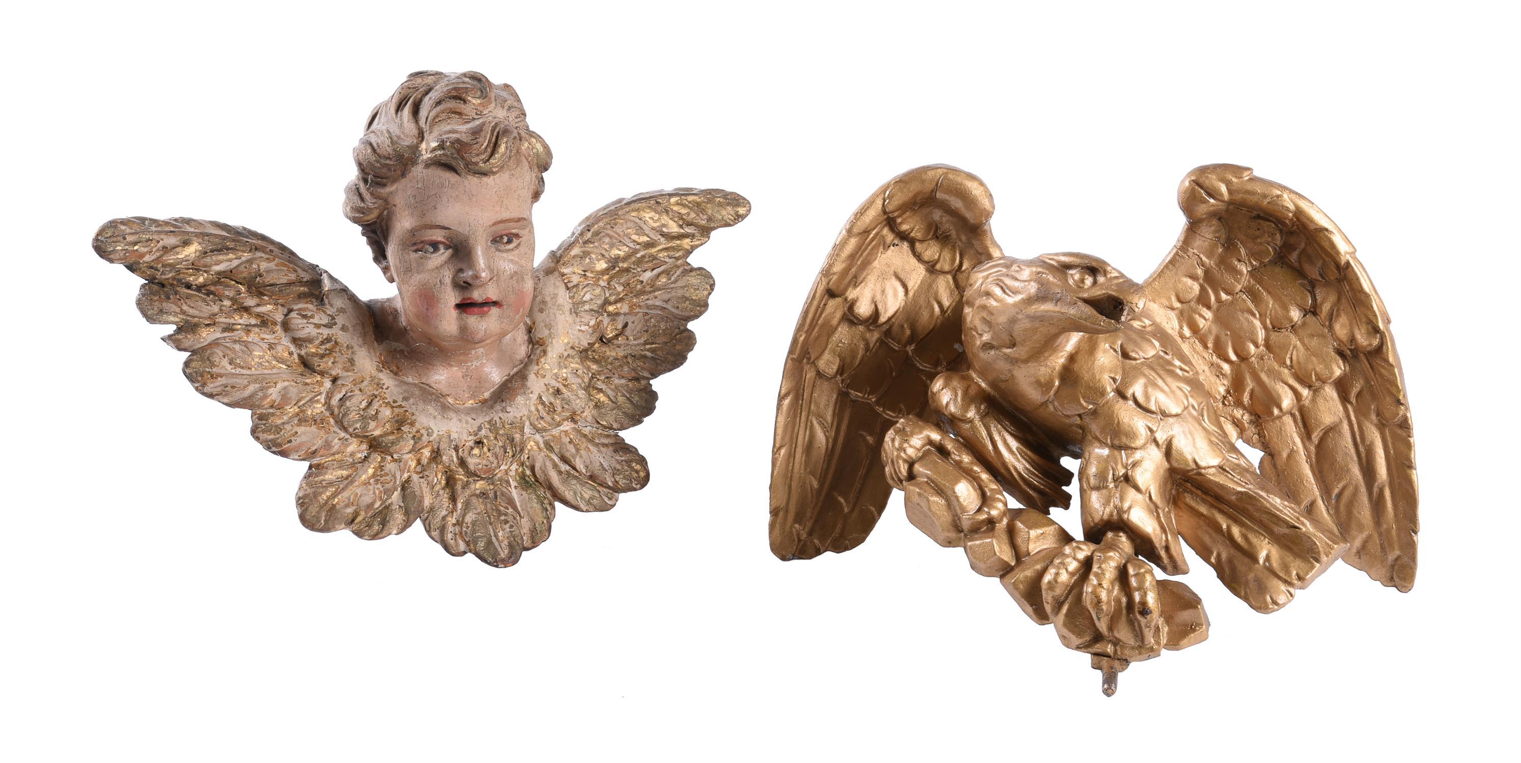 A Continental polychrome painted and parcel giltwood model of a putto