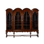 A pair of walnut bookcase cabinets in Queen Anne style