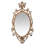 A George III giltwood and composition oval wall mirror