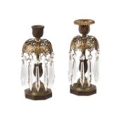 A pair of Regency parcel gilt and patinated bronze lustre candlesticks