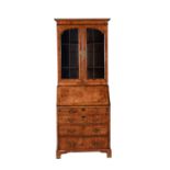 A George II walnut and feather banded bureau bookcase