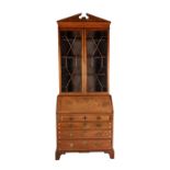 A mahogany bureau bookcase