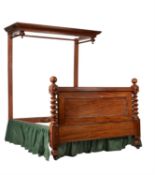 A Victorian mahogany half tester bed