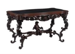 An Italian carved walnut library or centre table