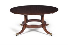 A mahogany circular concentric extending dining table